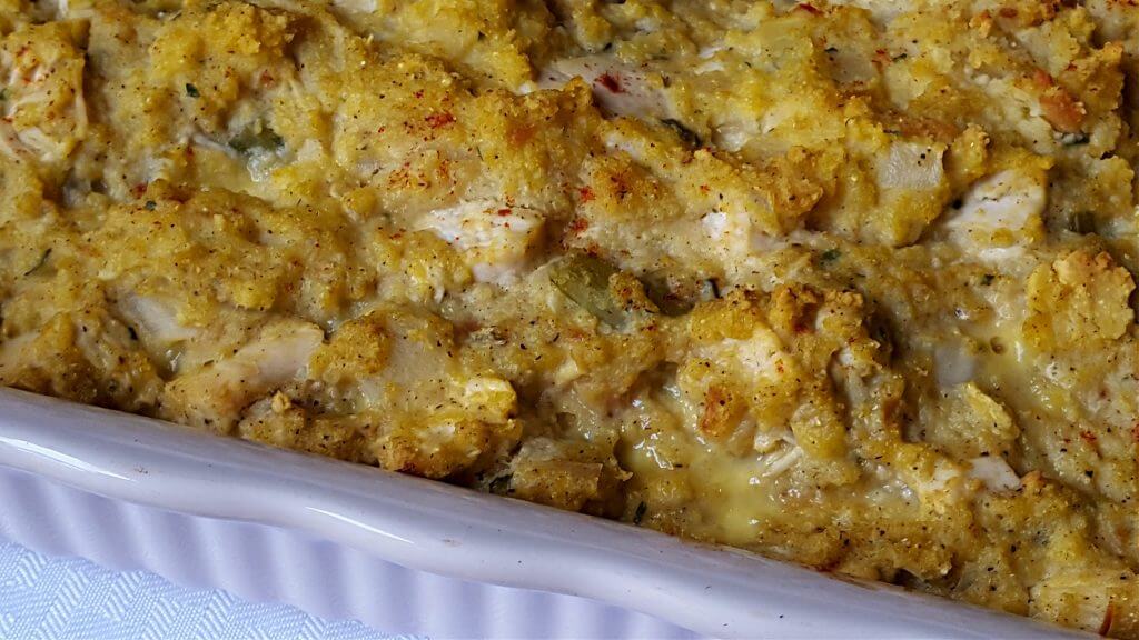 Casserole baking dish with chicken and cornbread dressing