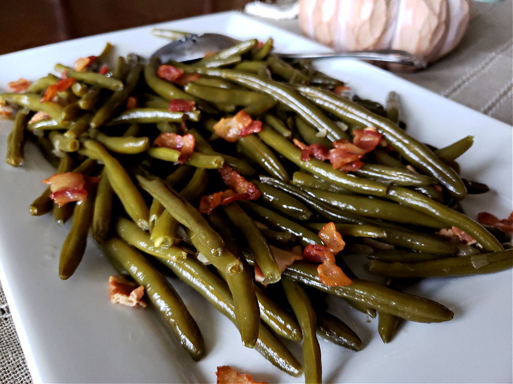 Southern style green beans in a serving dish for Thanksgiving dinner