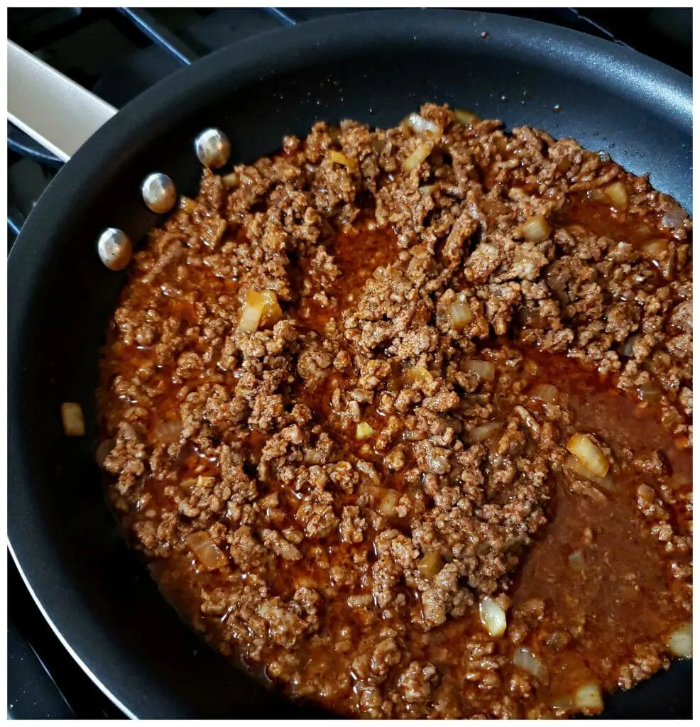 meat sauce for hot dogs cooking in a skillet