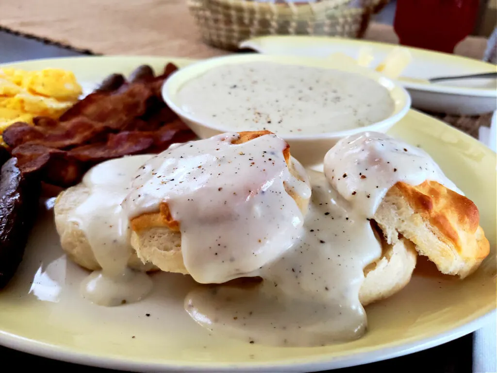 Country White Gravy Recipe served on a yellow platter with breakfast foods