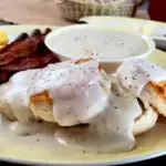 Country White Gravy Recipe served on a yellow platter with breakfast foods