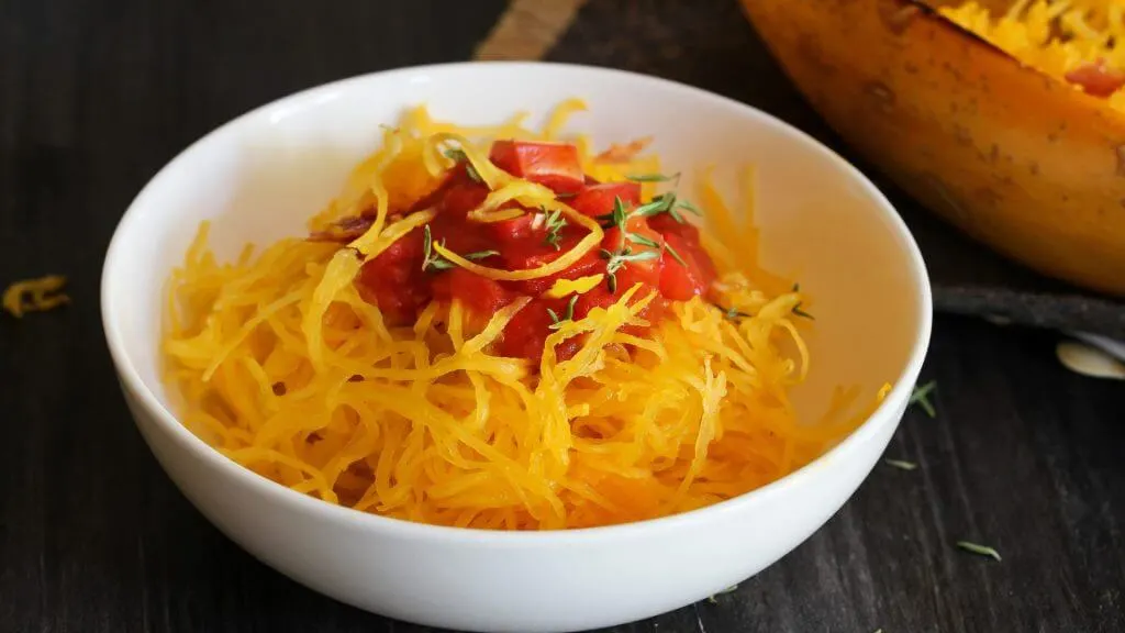 Spaghetti Squash in a bowl topped with tomato sauce