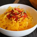 Spaghetti Squash in a bowl topped with tomato sauce