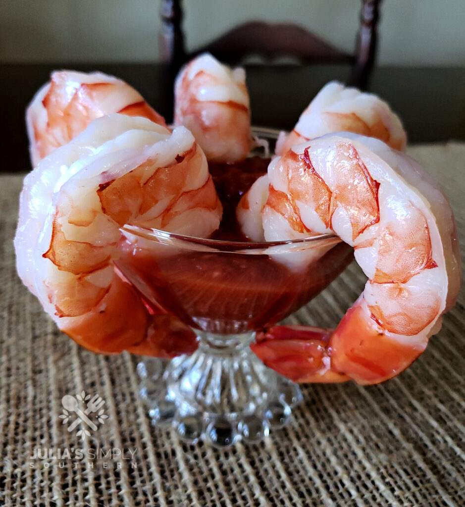 Classic Shrimp Cocktail Sauce Recipe in a serving glass with jumbo prawns