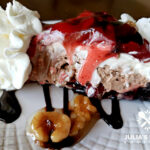 Amazing chocolate strawberry nut sundae pie dessert with a chocolate drizzle and candied nuts and whipped cream