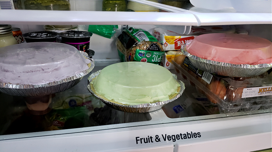 Chilling Kool Aid pies in the refrigerator