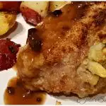 Stuffed Pork Chop on a plate with red potatoes