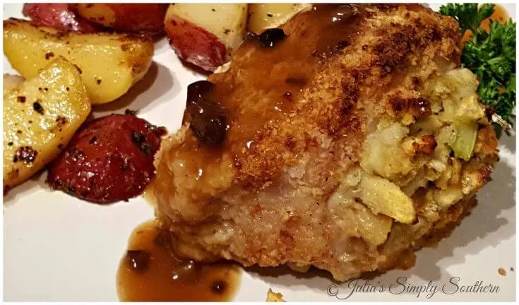 Stuffed Pork Chop on a plate with red potatoes