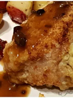 Stuffed Pork Chop on a plate with red potatoes