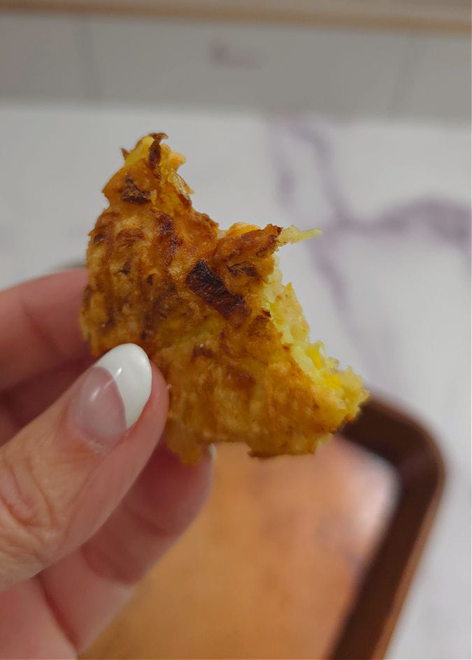 Crispy homemade fried yellow squash fritter with seasoned golden coating