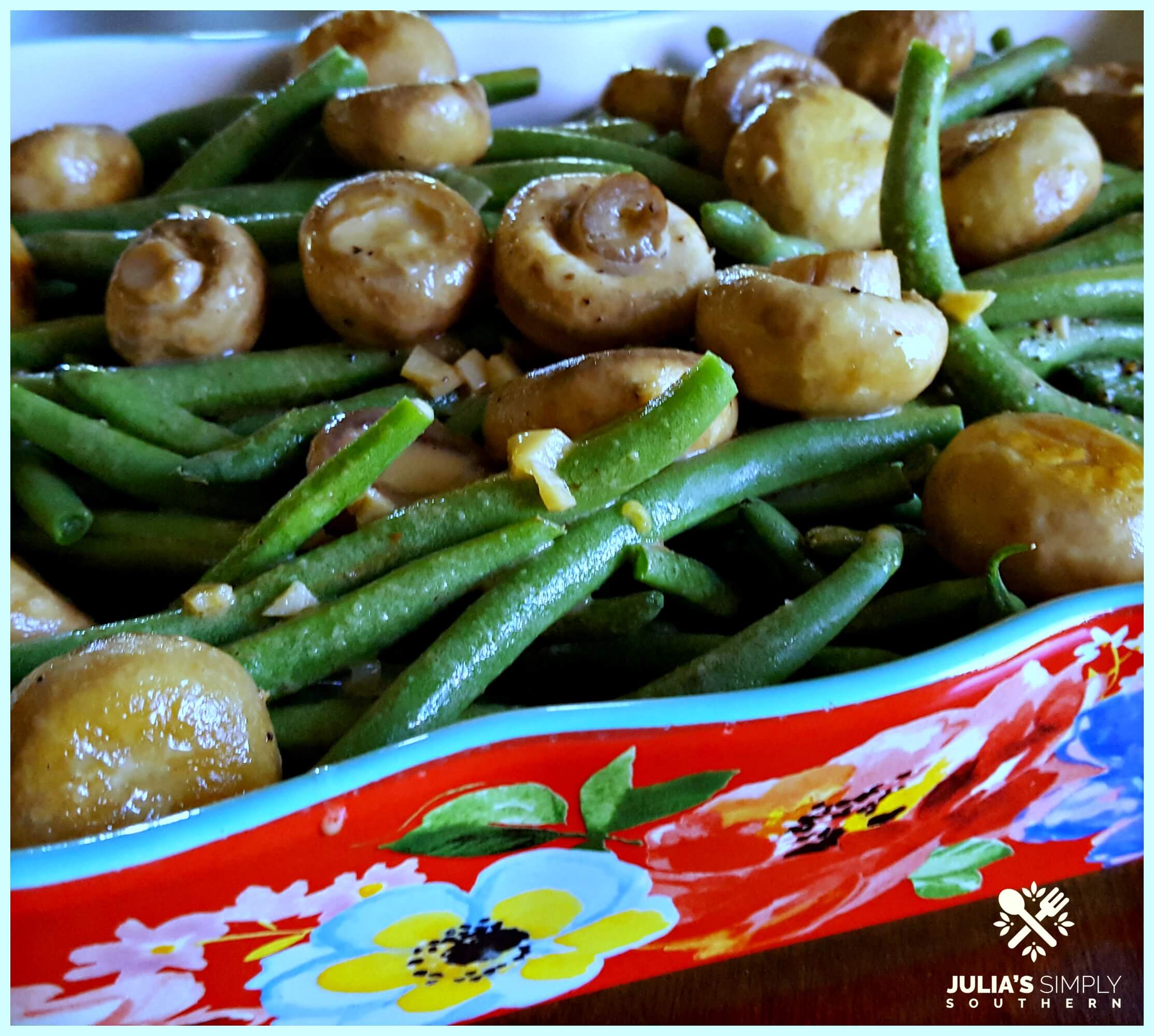 Fresh Green Beans and Fresh Mushrooms with garlic side dish in a red floral casserole dish