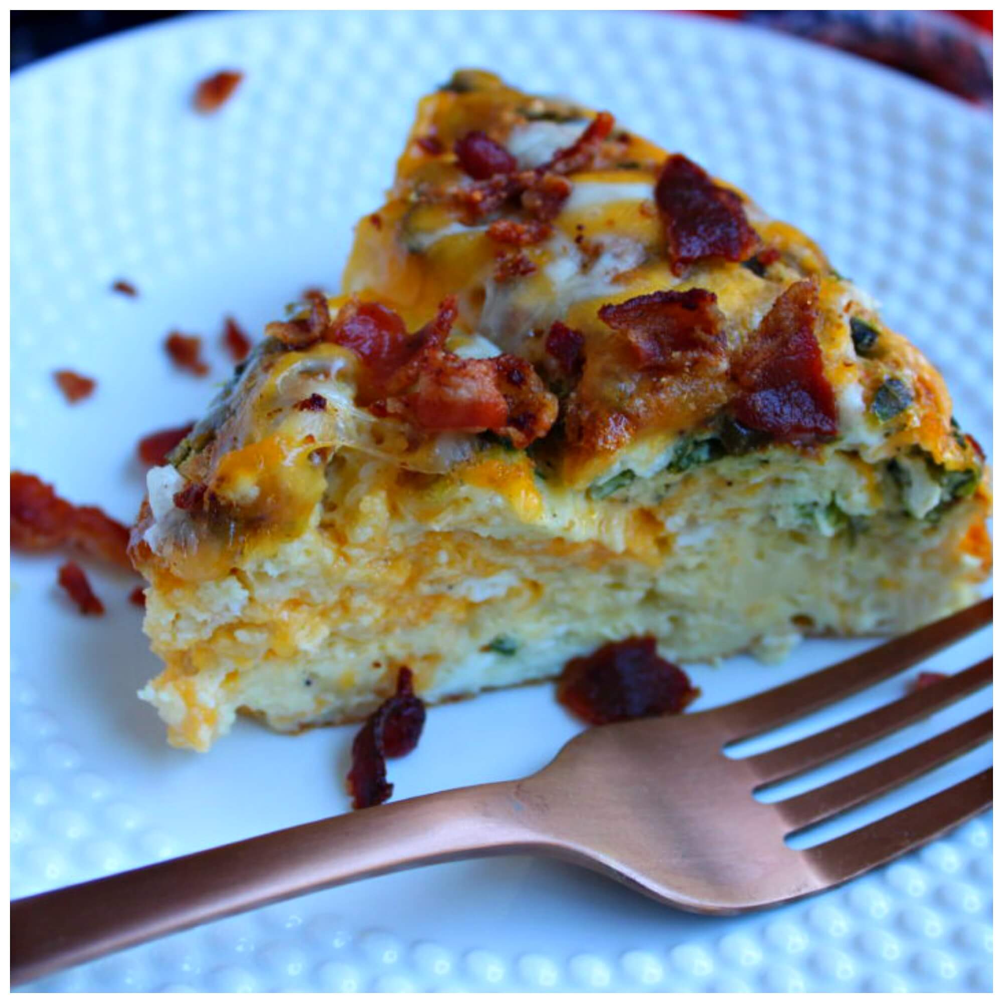 Breakfast casserole with bacon on a white plate