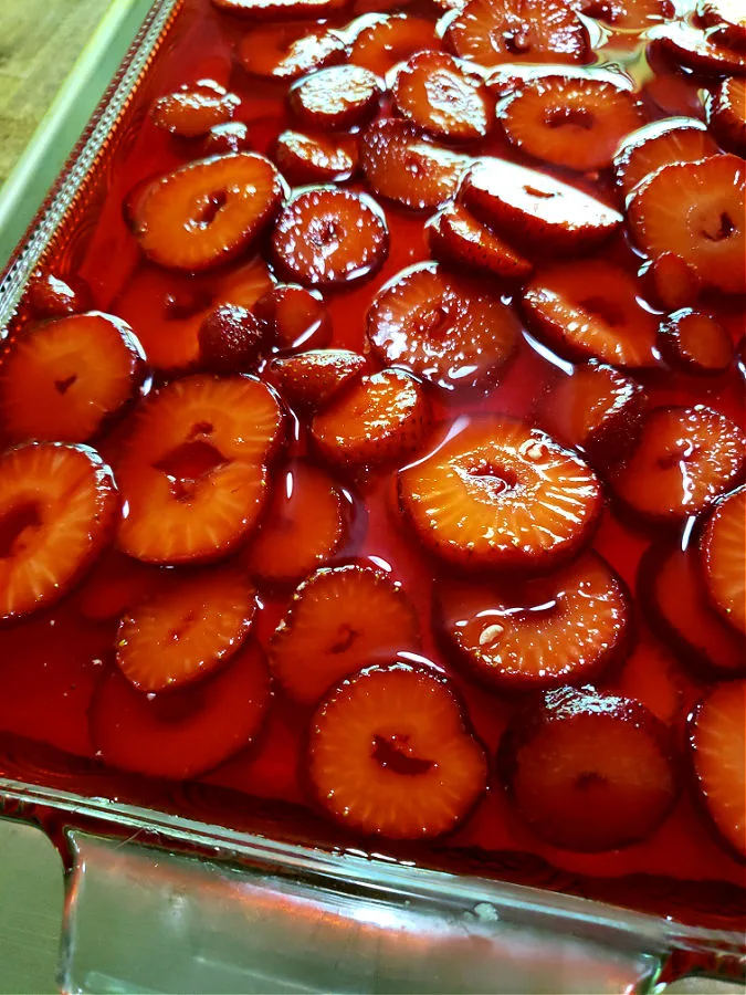 Final layer of strawberry pretzel salad before chilling in the refrigerator