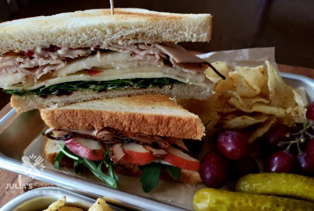 Autumn turkey sandwiches with cranberry aioli, sliced pear, arugula and white cheddar