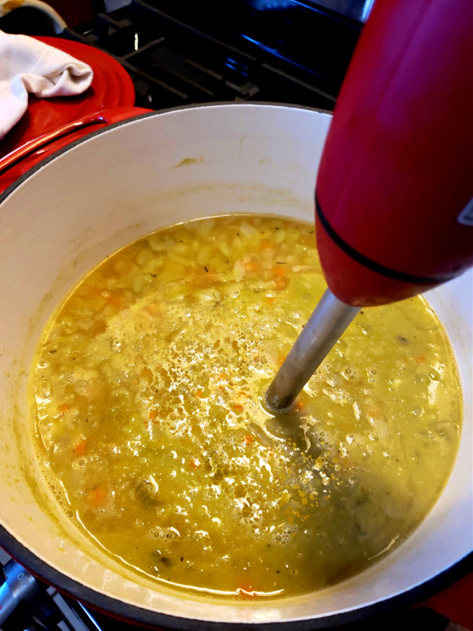 pureeing soup with an immersion blender