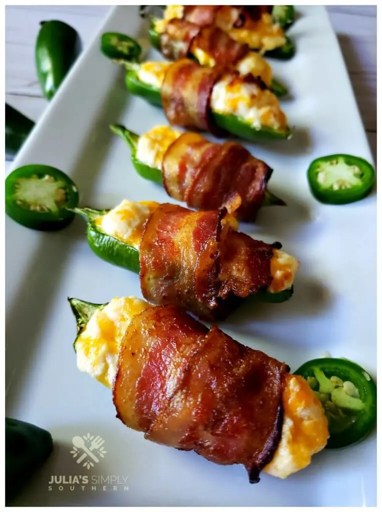 Appetizer platter filled with delicious jalapeno poppers. This recipe post tells all about how to make them.