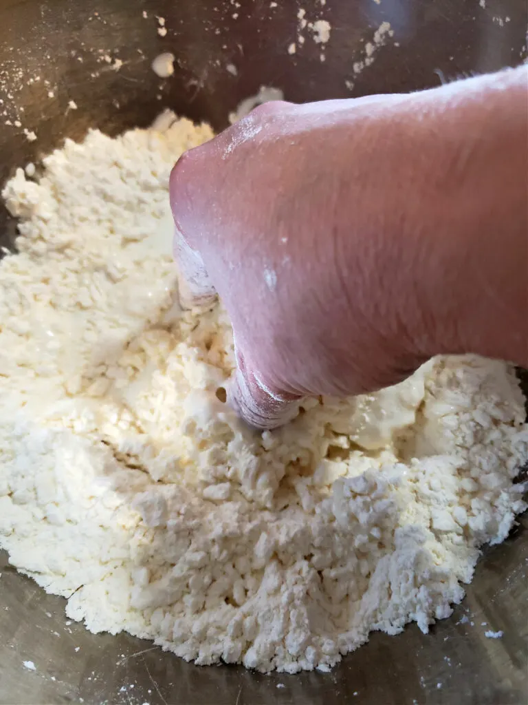 Mixing biscuit dough by hand