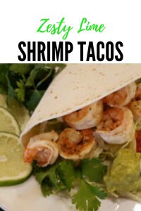 Zesty Lime Shrimp Tacos in soft flour tortilla shells with toppings such as lettuce, fresh cilantro, guacamole and sour cream or salsa #seafood #creole #fresh #EasyRecipes