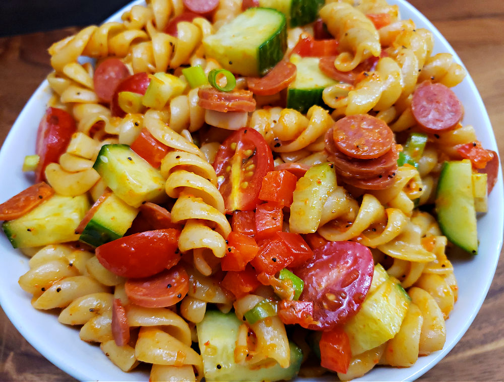 Marinated pasta salad with vegetables, mini pepperoni, and Salad Supreme