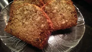 Banana bread with toasted pecans on a plate