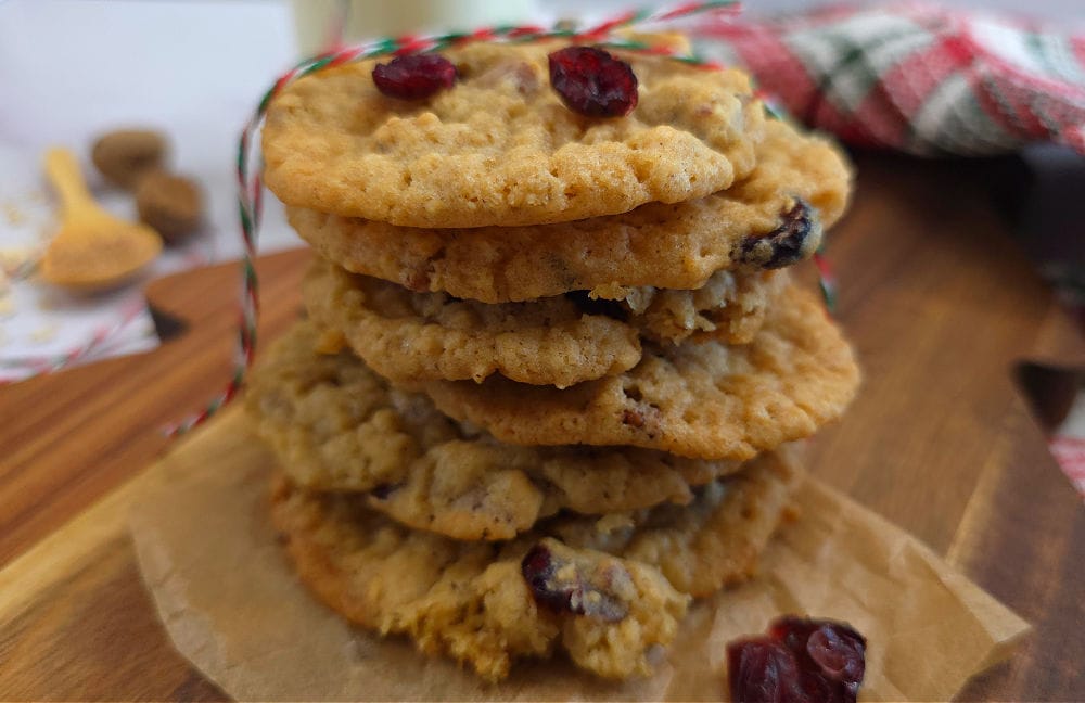stack of oatmeal cranberry pecan cookies arranged to look festive for Christmas