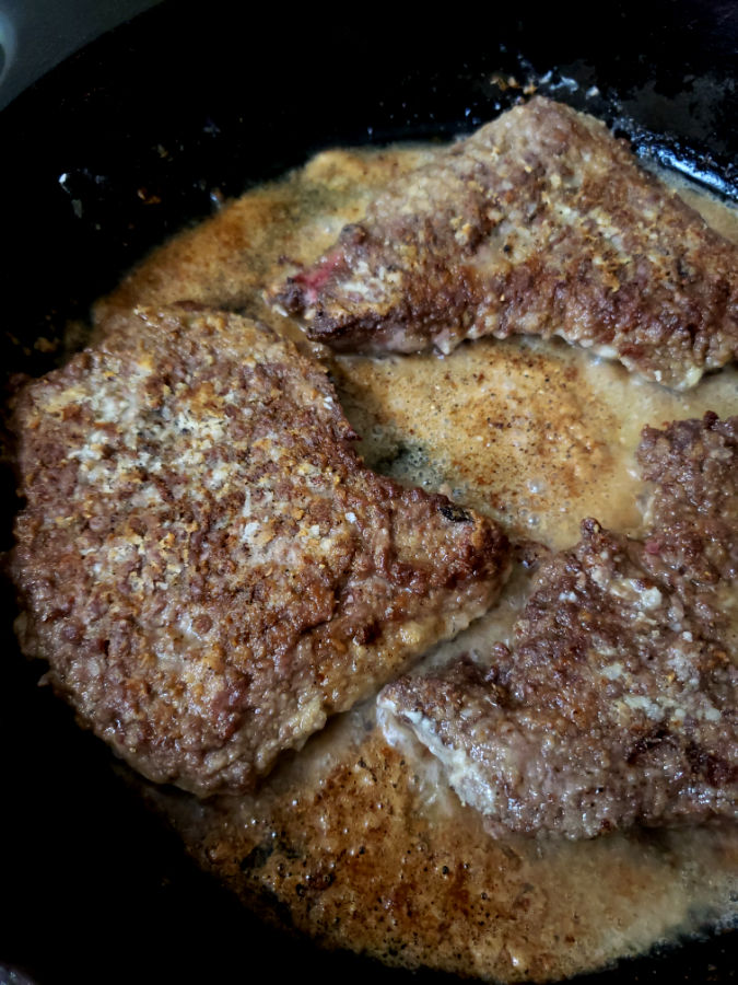 pan frying cube steaks before Crock pot cooking in homemade gravy