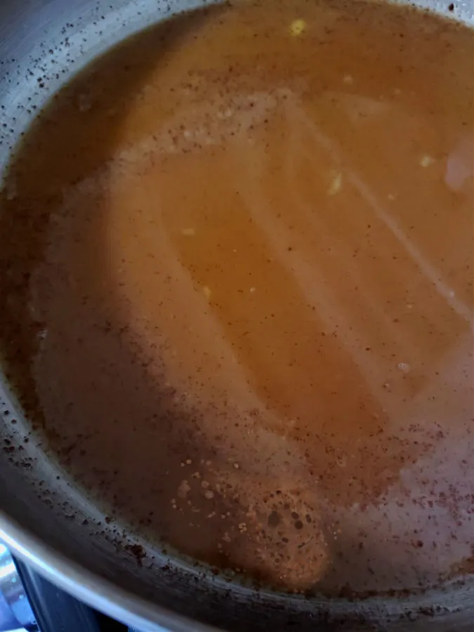 Preparing a brown sugar glaze for carrots and pineapple
