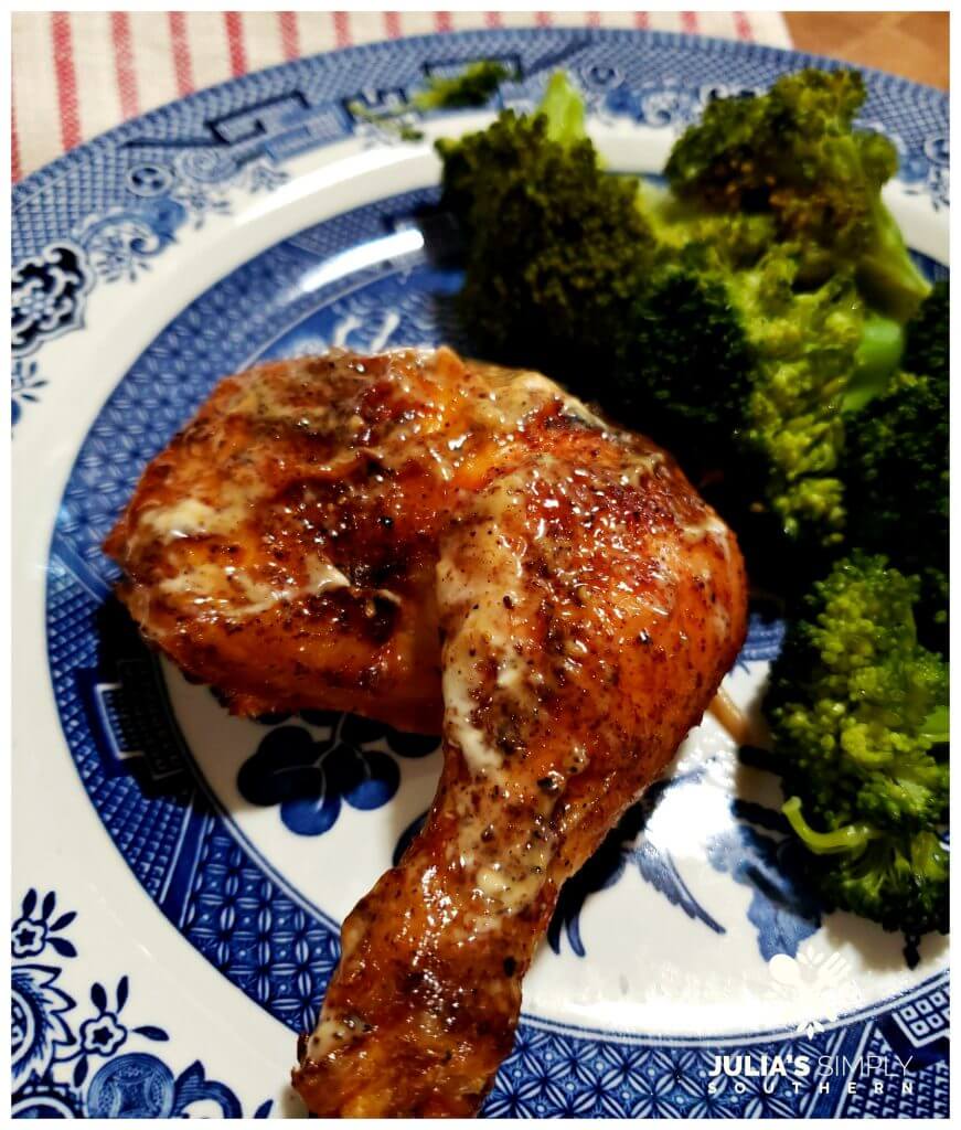 Grilled chicken with a vegetable side on vintage dinnerware