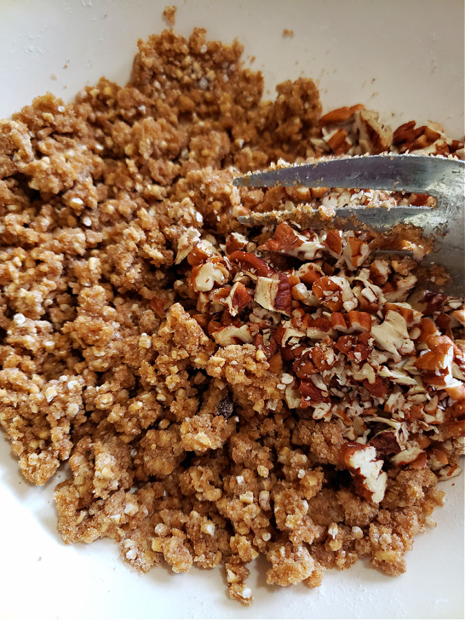 crispy streusel topping with pecans in a bowl