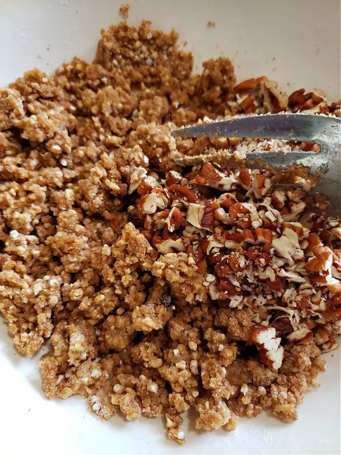 crispy streusel topping with pecans in a bowl