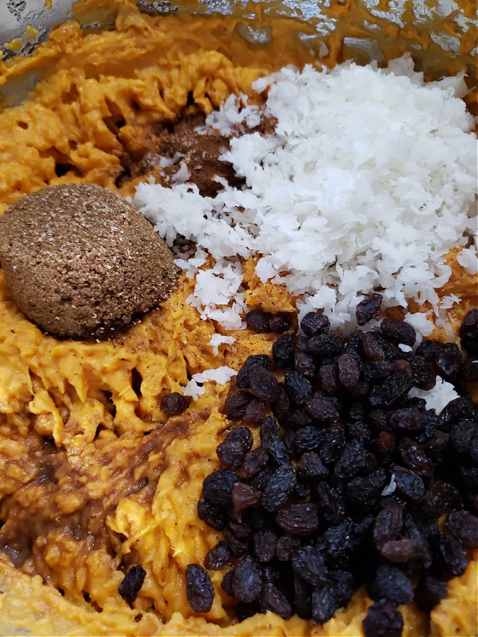 sweet potato base in a mixing bowl with other ingredients to make a soufflé side dish.