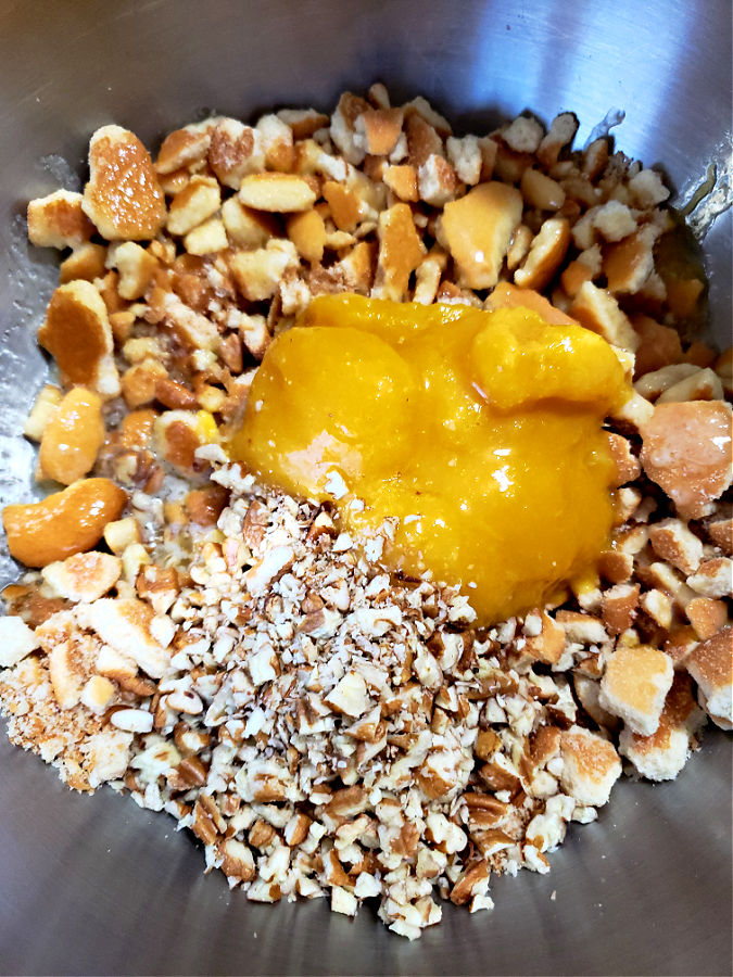 mixing bowl with ingredients to make orange balls
