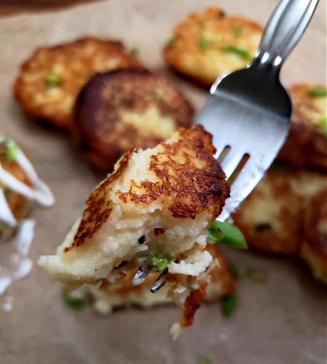 fork with a bite of leftover mashed potato patty