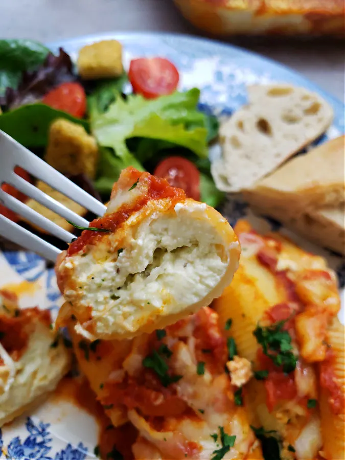 simple stuffed shells with ricotta cheese filling serve with bread and salad