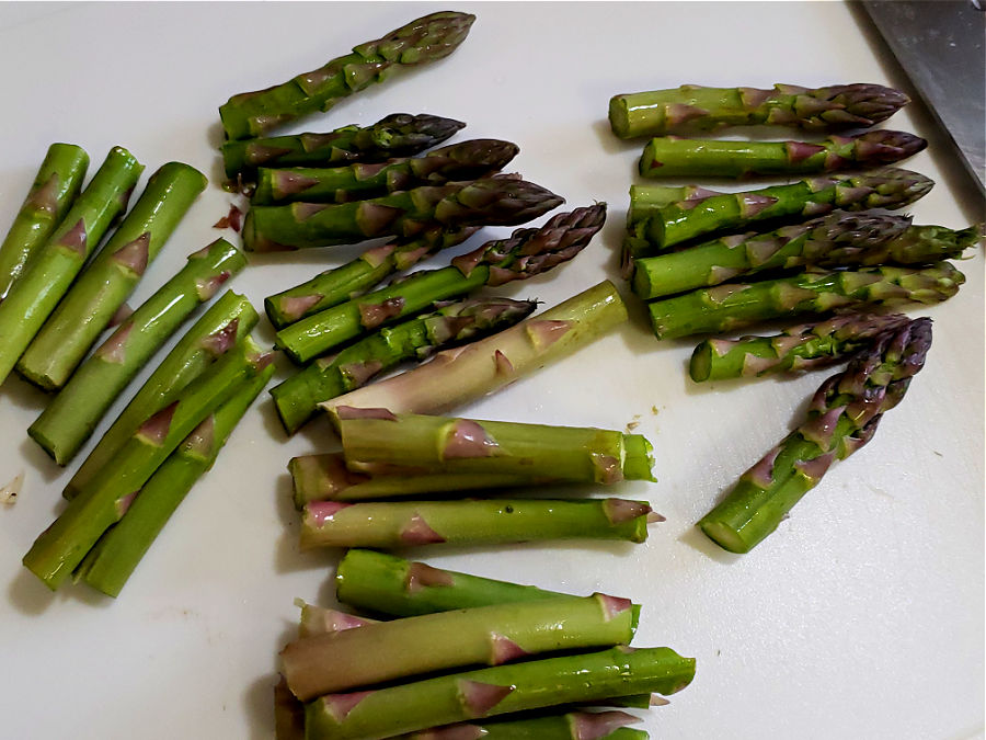 cutting up spears of asparagus