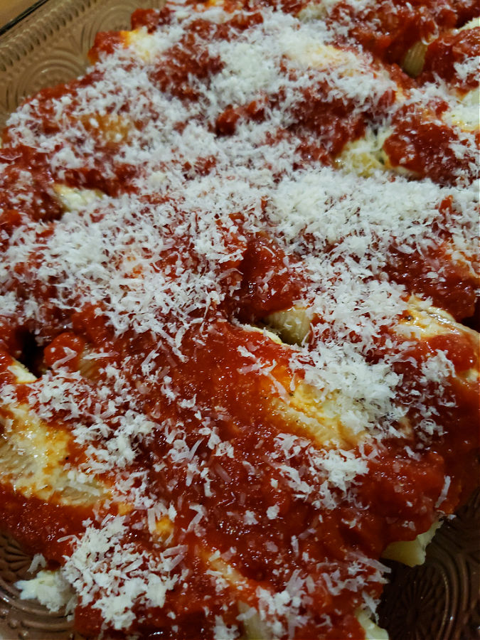 grated parmesan Reggiano layer over stuffed shells 